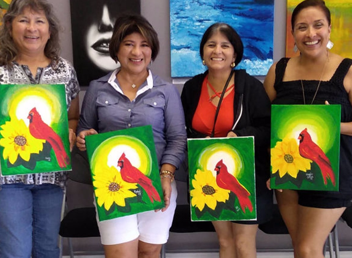 Women holding red cardnial paintings