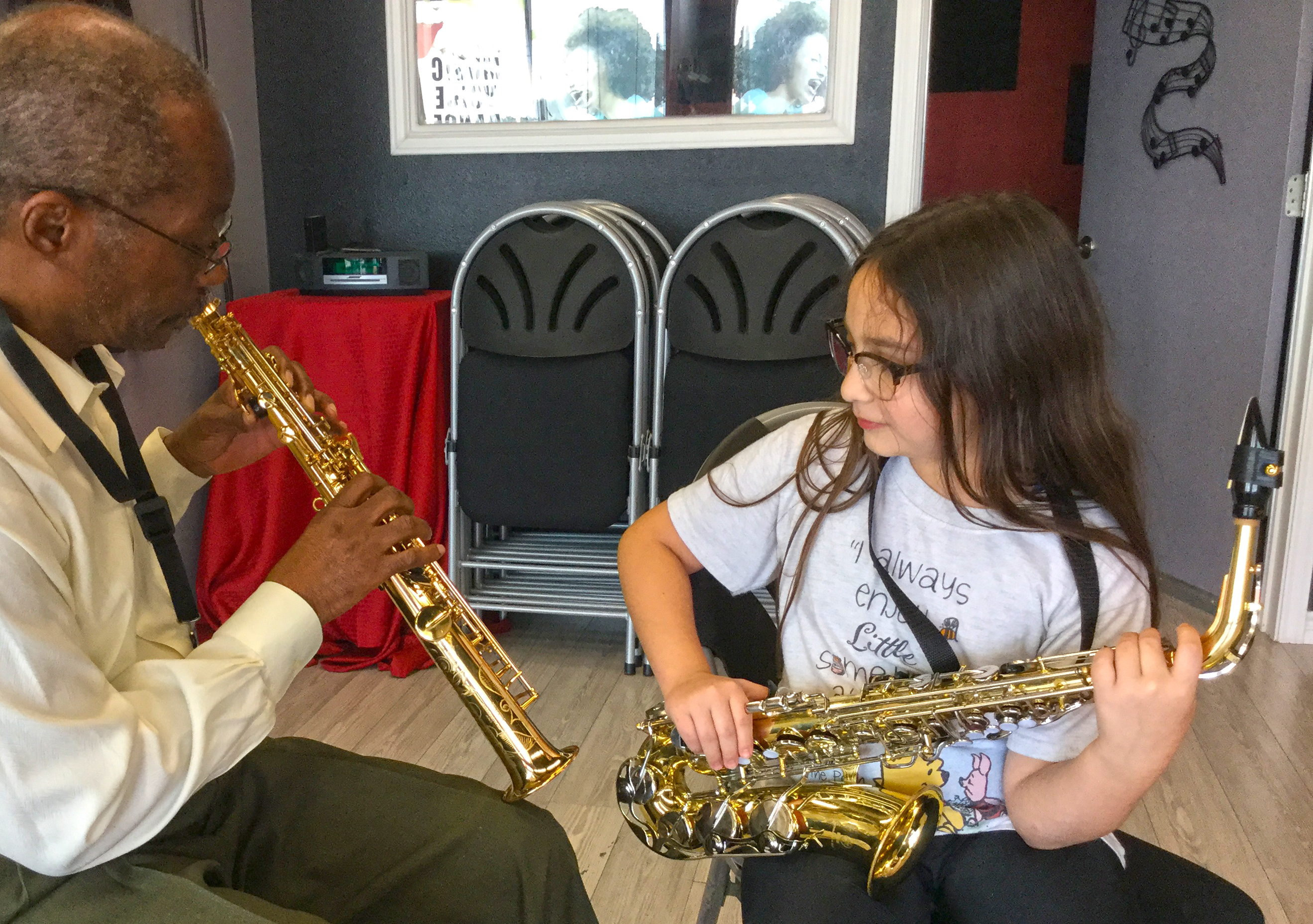 student learning to play saxophone